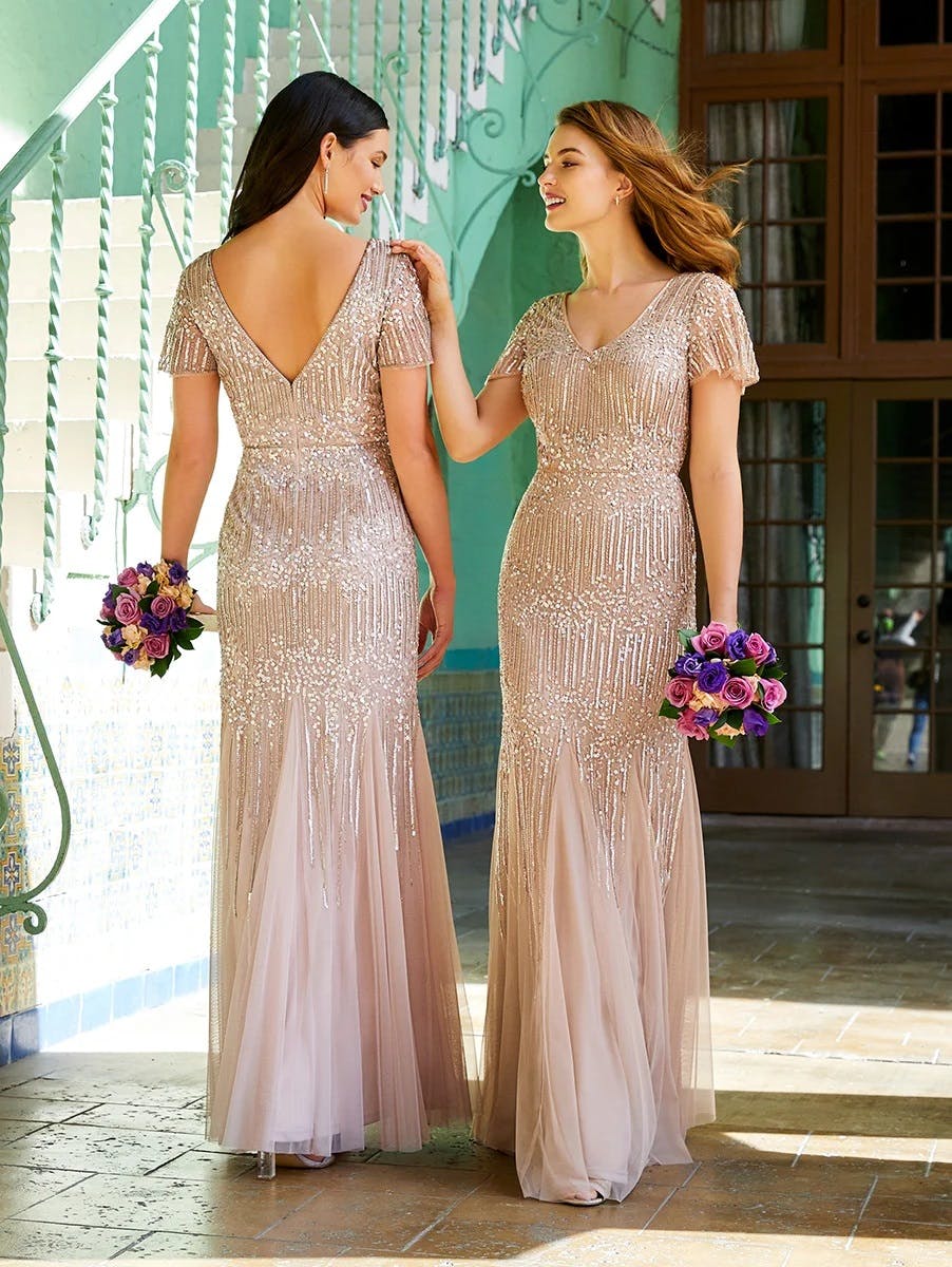 Picture of two bridesmaids facing opposite directions wearing Adrianna Papell dresses